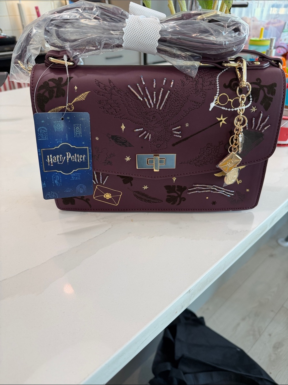 Warner Bros. Plum Harry Potter Crossbody with Gold Charm Accents